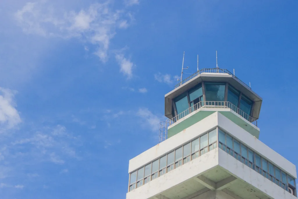 Airport control tower against a blue sky